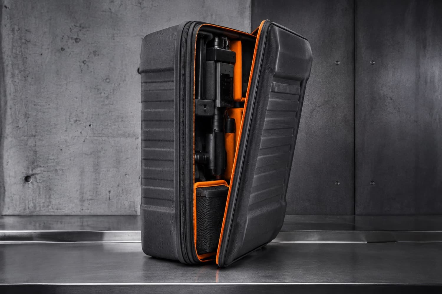 A case at an inspection bench, its cover still fitted with only the access zipper opened.